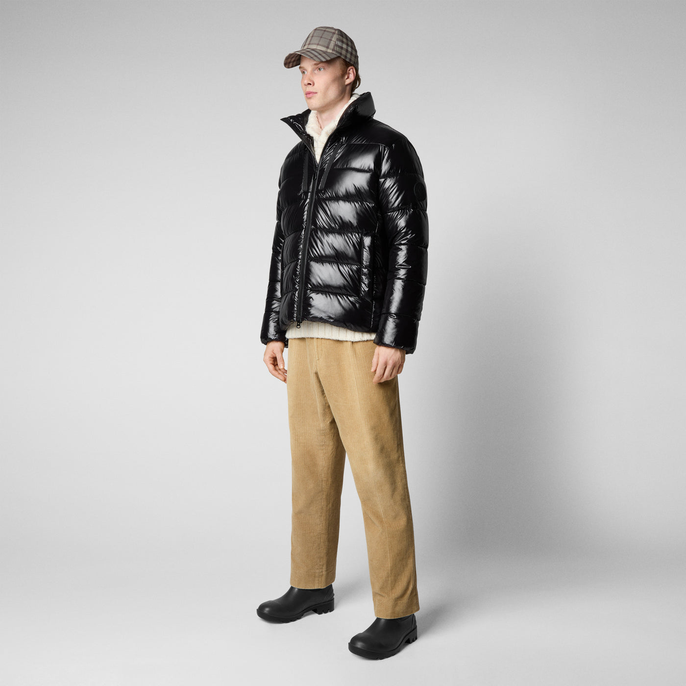 Model Side View of Men's Mitch Puffer Jacket with Tall Standing Collar in Black