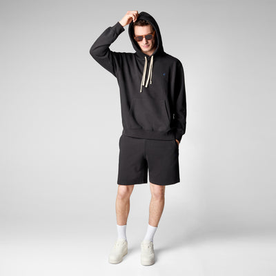 Model Life-Style Image of Men's Edson Hoodie in Black