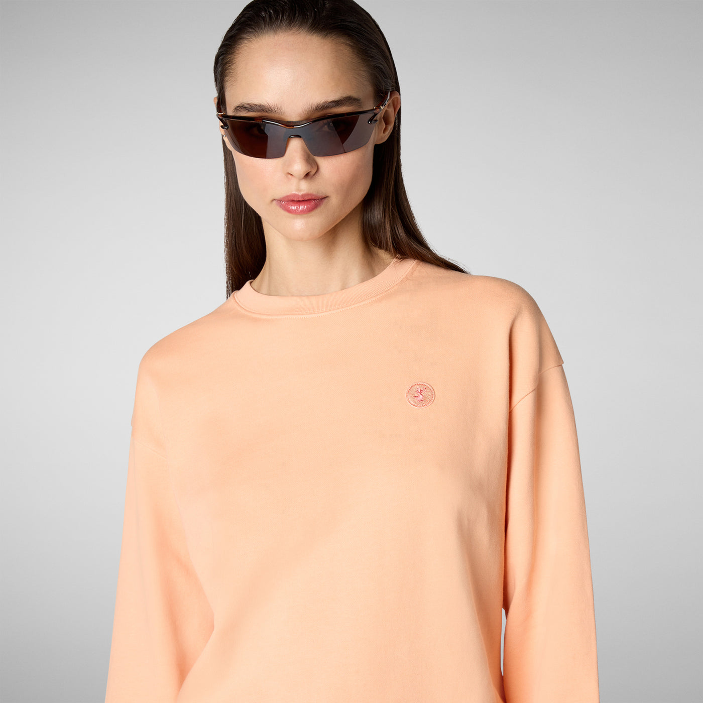 Model Close-up View of Women's Ligia Crewneck Sweatshirt in Papaya Orange
