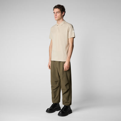 Model side view of Men's Ovidio Polo Shirt in Rainy Beige